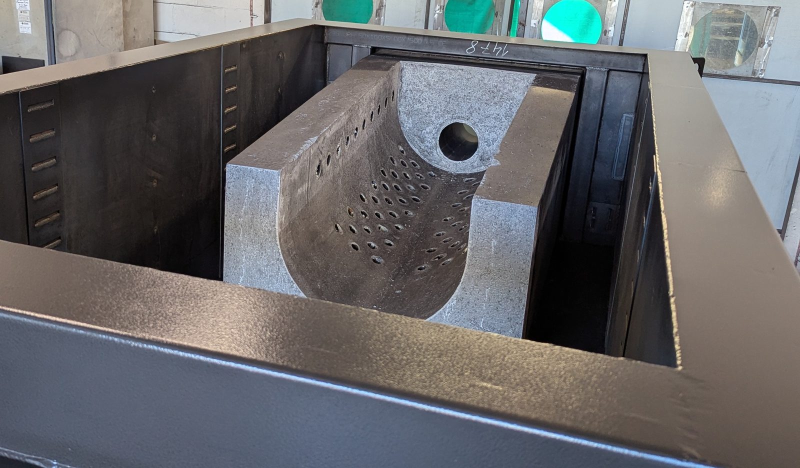 Factory photograph of the fixed retort grate fitted into the steel base of a Ranheat M17 biomass boiler before refractory base casting