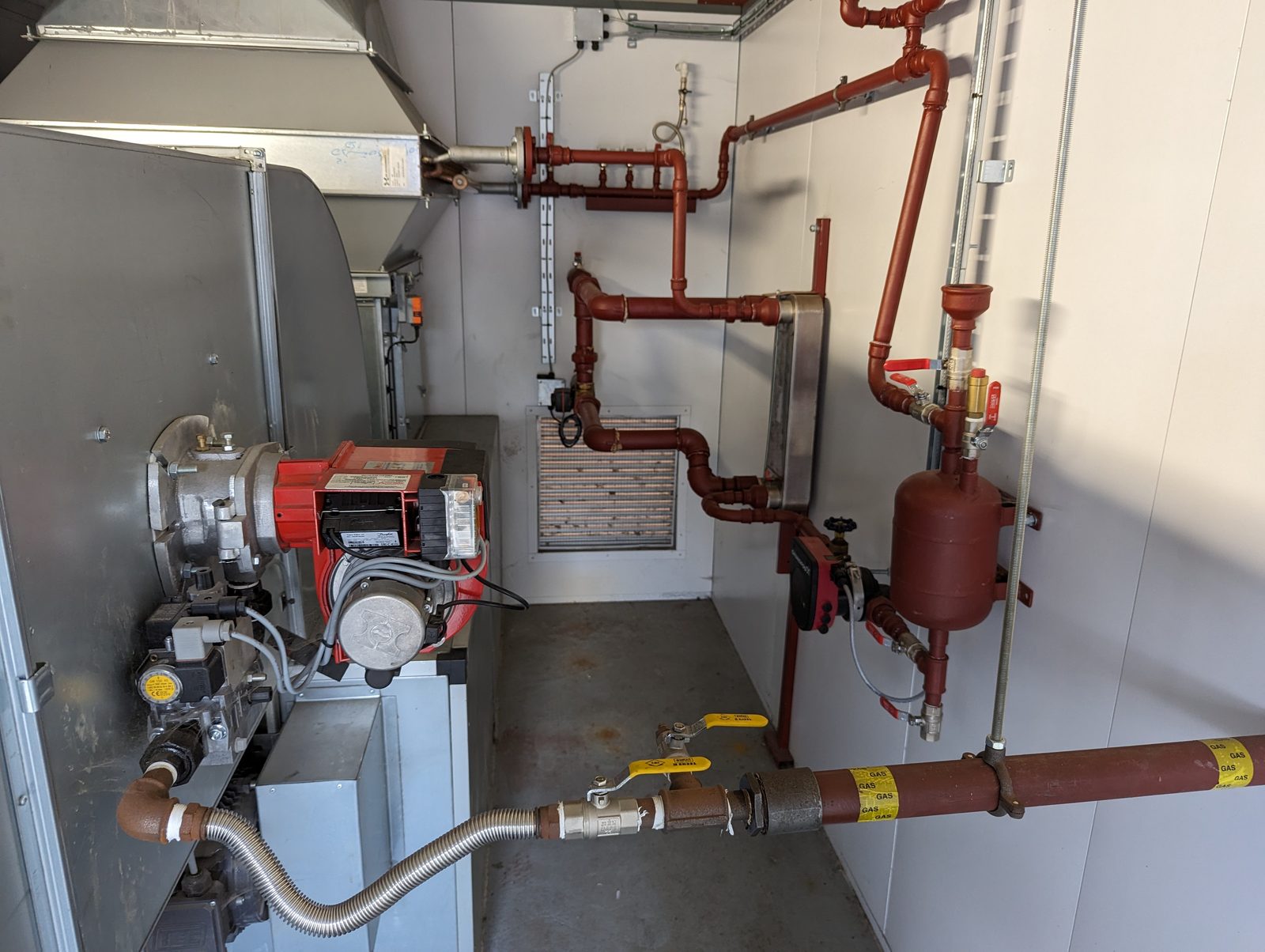 Ranheat duct heater with burner and antifreeze loop pipework installed in a containerised plant room