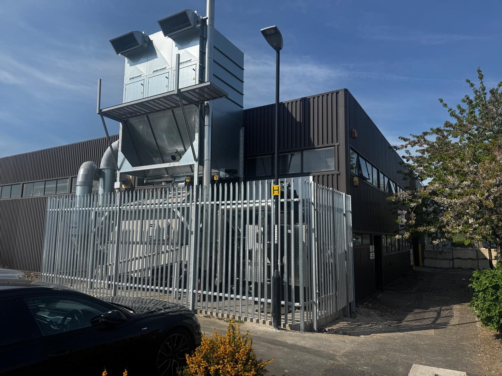 Ranheat WA 150 warm air heater at Kustom Designs with a B10 bunker silo direct-fed from a roof-level dust extraction system