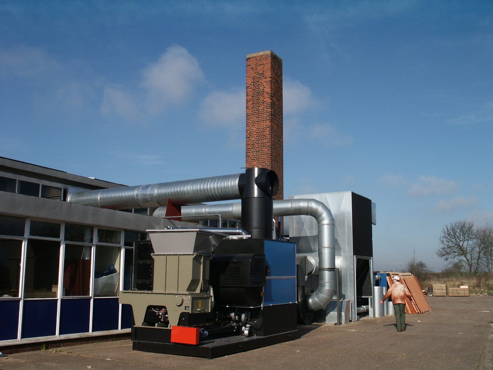 Perspective view of Ranheat WA 300 warm air heater, hogger loader and galvanised ducting at A&J Sectional Building