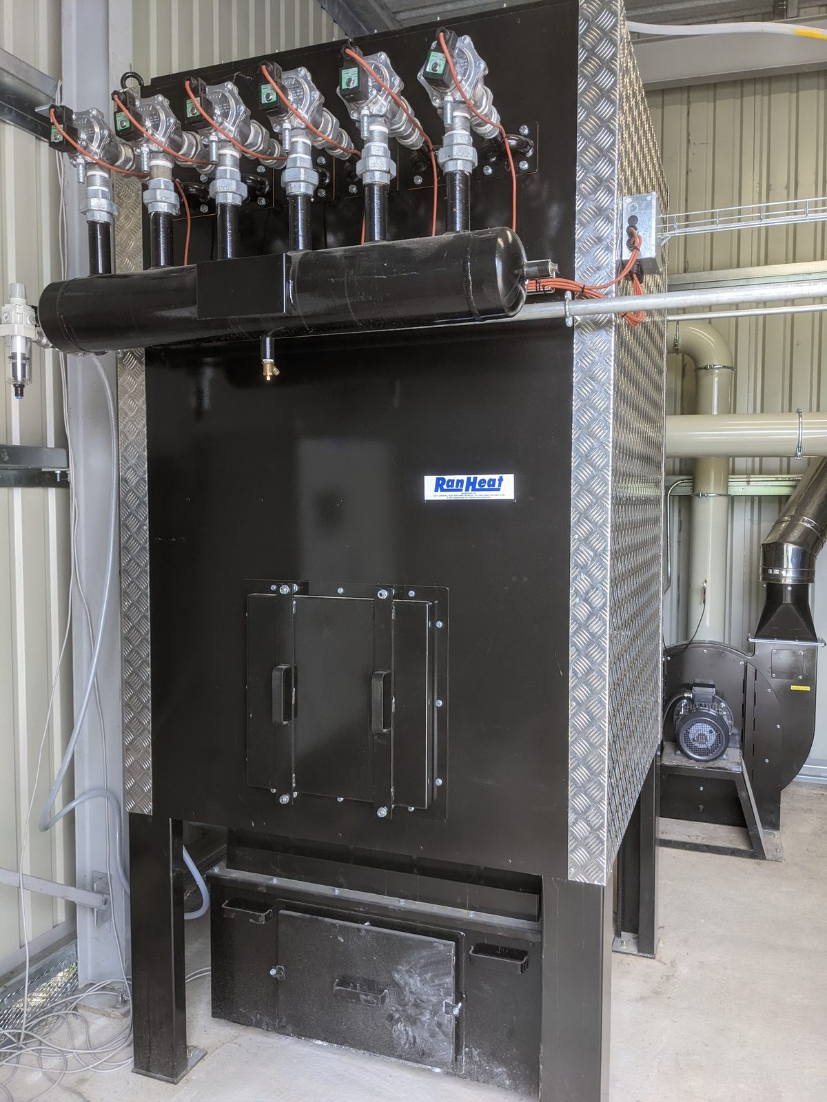 Site photograph of a Ranheat ceramic filter with six filter cells fitted to a WA 300 warm air heater plant